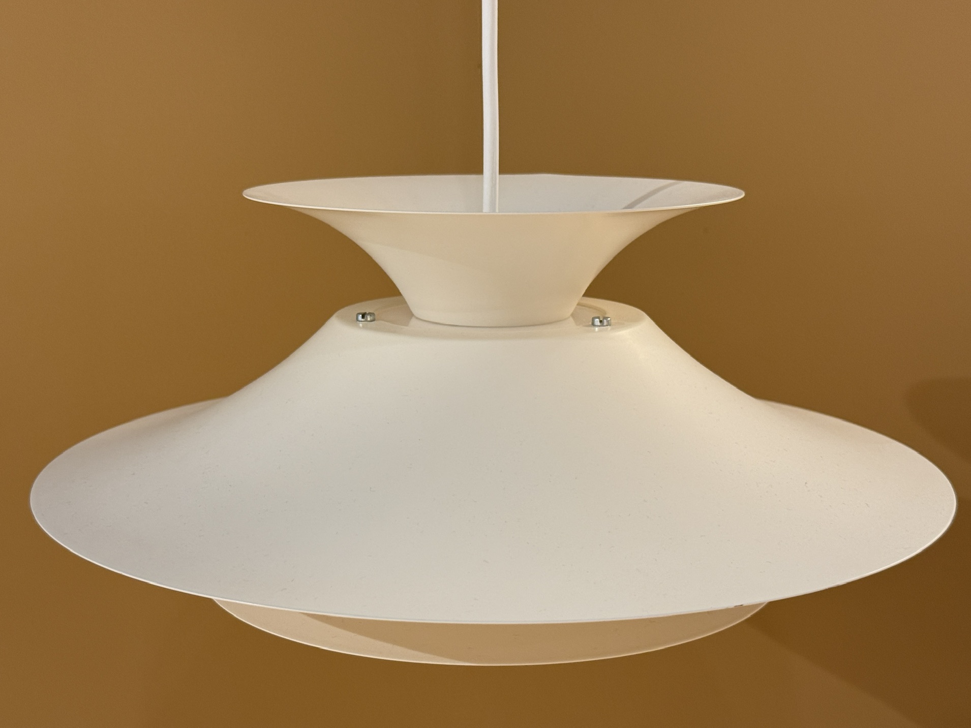 Vintage Scandinavian pendant lamp in cream color with layered design and atmospheric light distribution