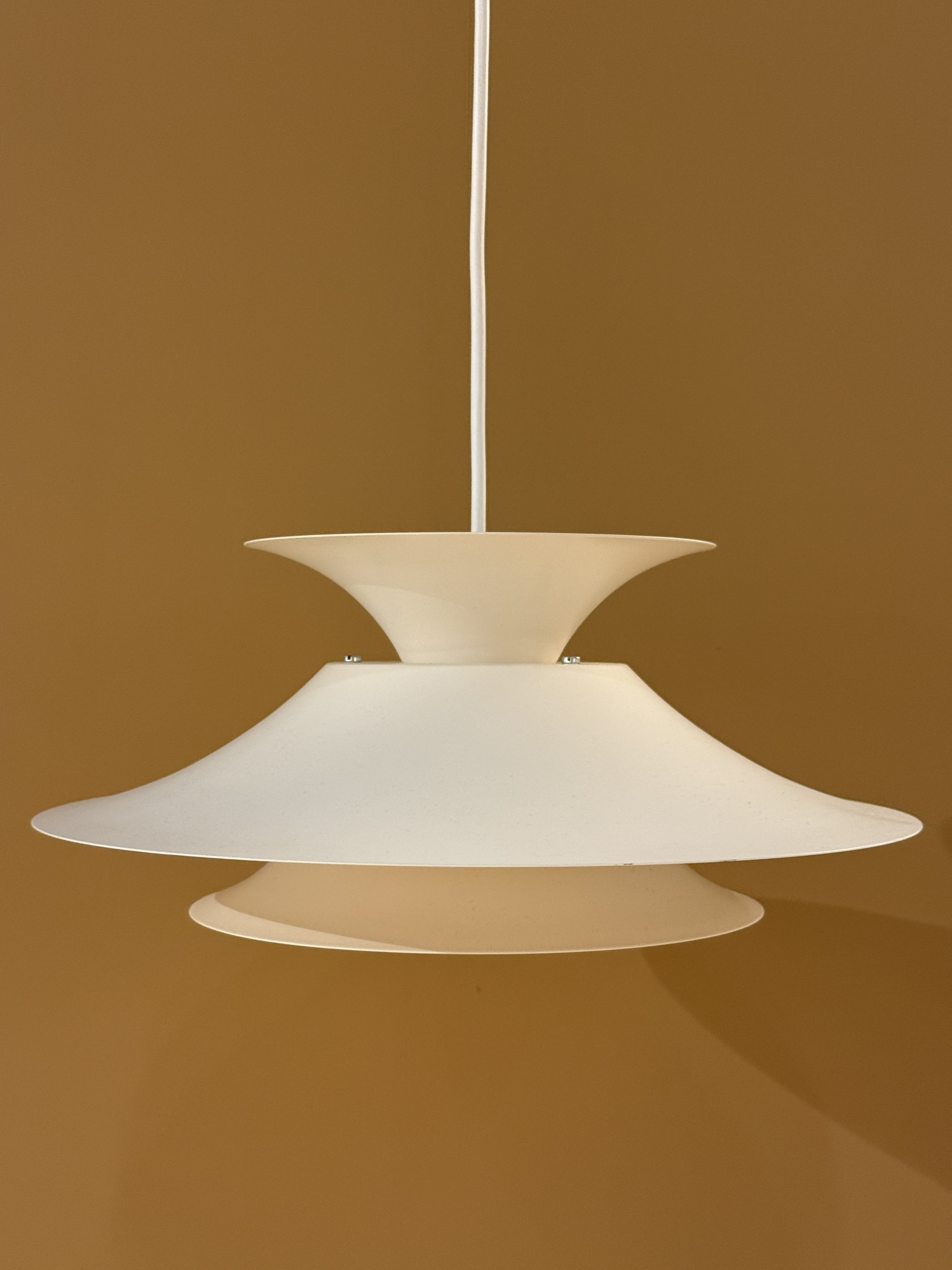 Vintage Scandinavian pendant lamp in cream color with layered design and atmospheric light distribution