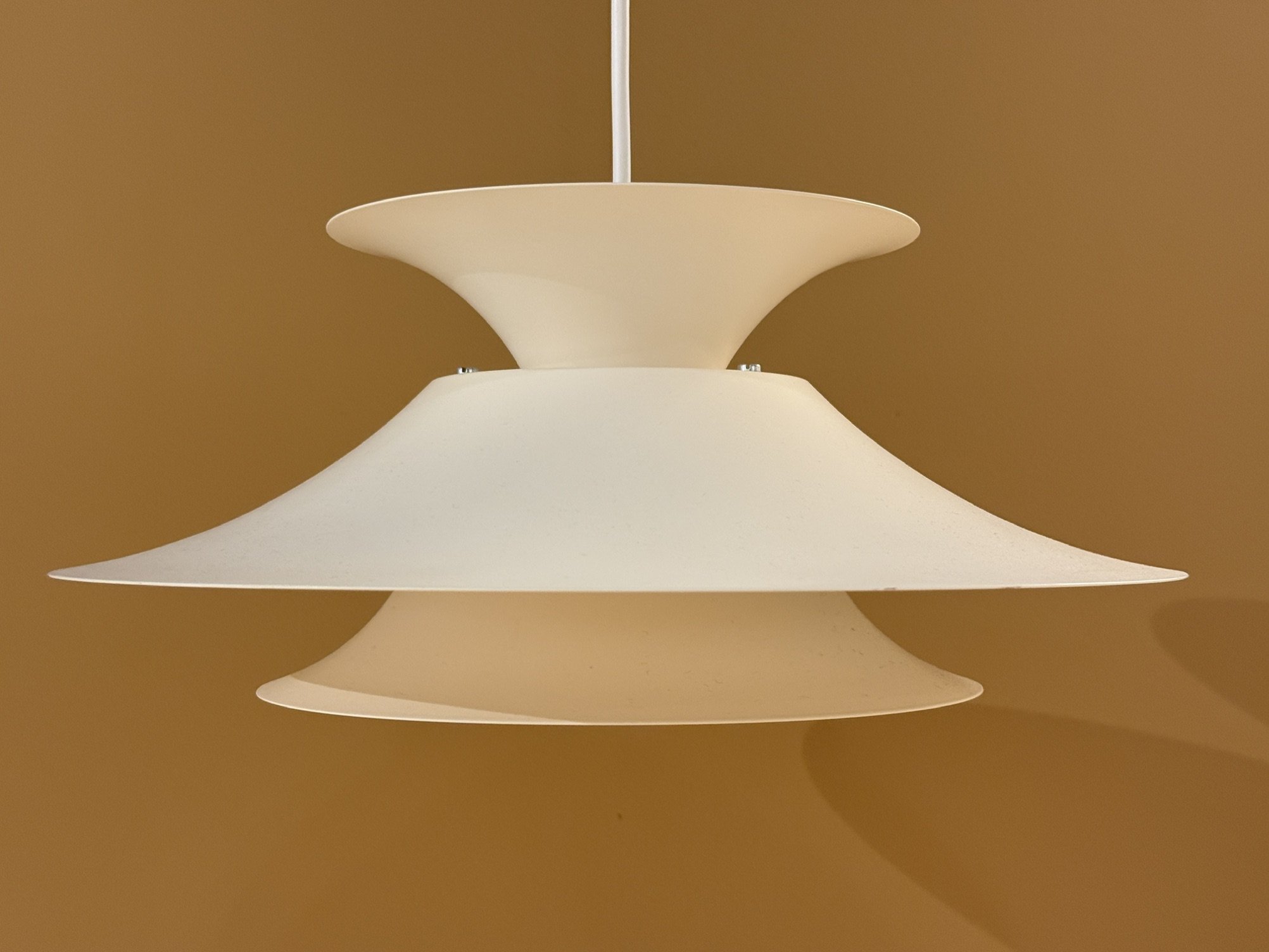 Vintage Scandinavian pendant lamp in cream color with layered design and atmospheric light distribution