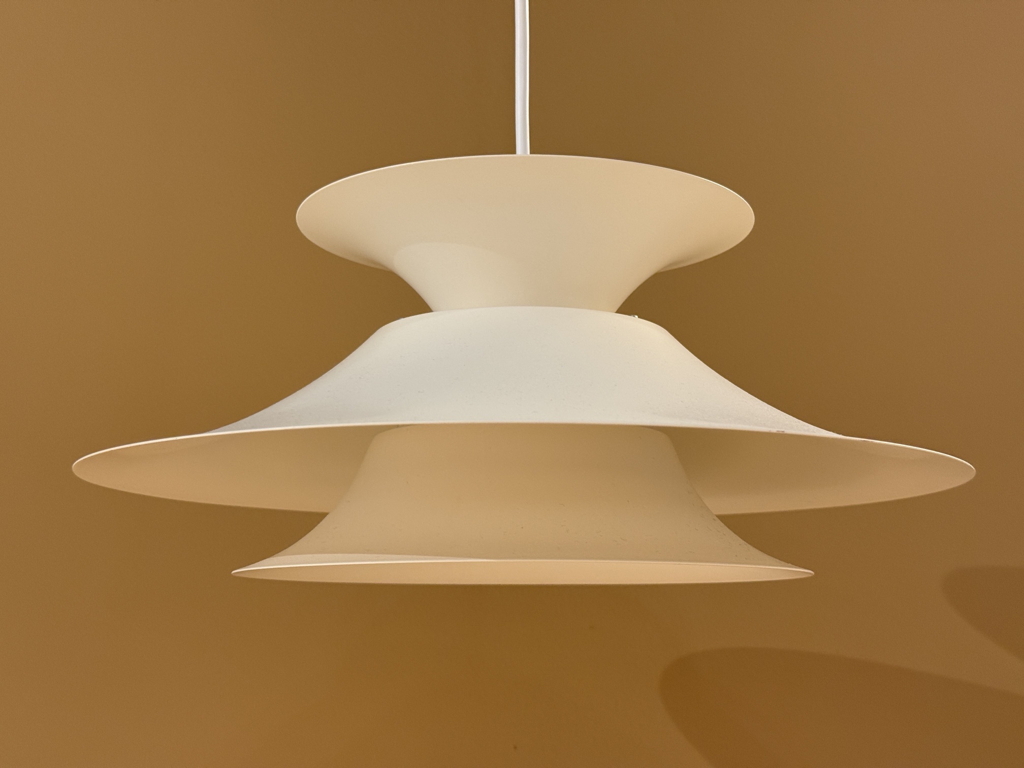 Vintage Scandinavian pendant lamp in cream color with layered design and atmospheric light distribution