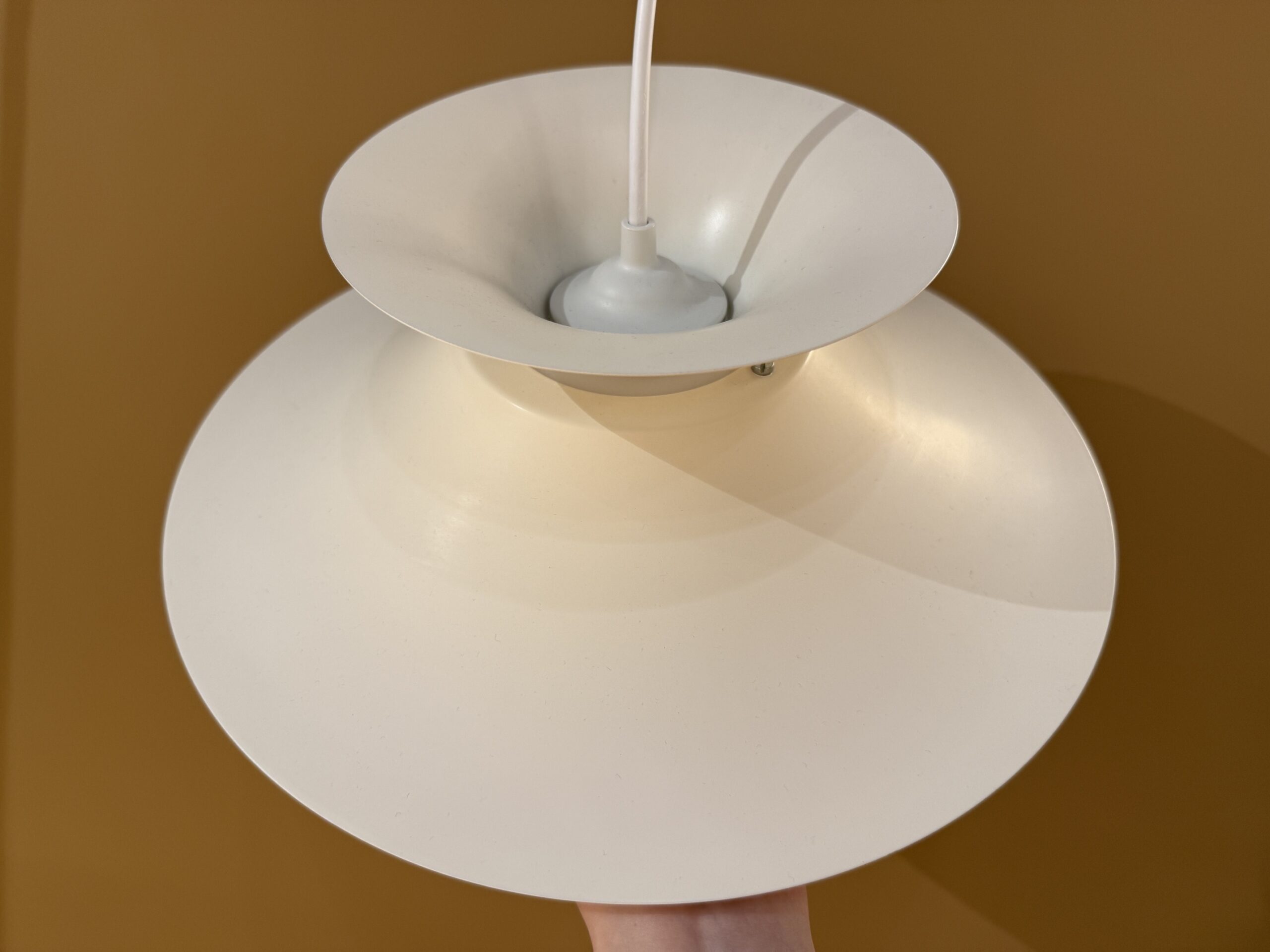 Vintage Scandinavian pendant lamp in cream color with layered design and atmospheric light distribution