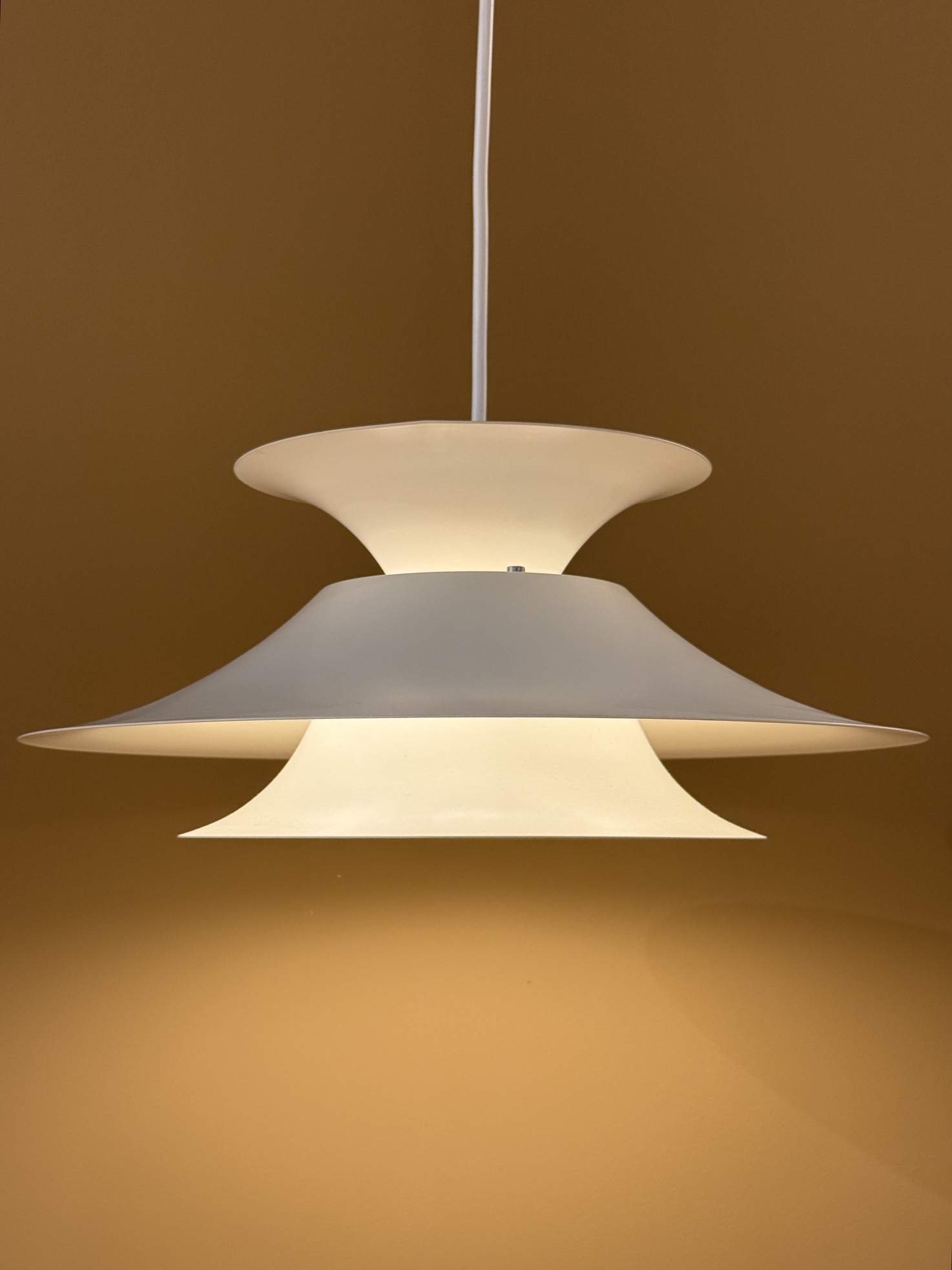 Vintage Scandinavian pendant lamp in cream color with layered design and atmospheric light distribution